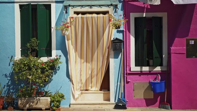 Real time medium shot of a colorful house on Burano island. Burano island is famous for its colorful houses.