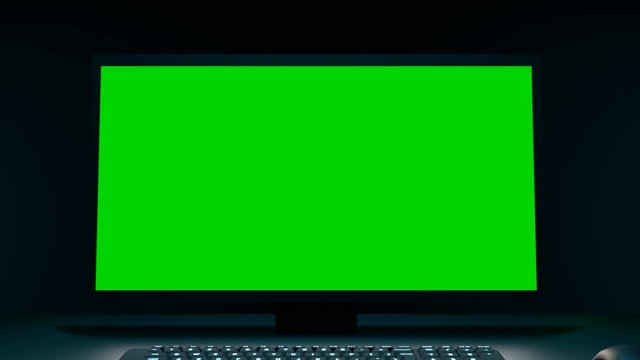 Zoom in on a pc with green screen. 3d animation