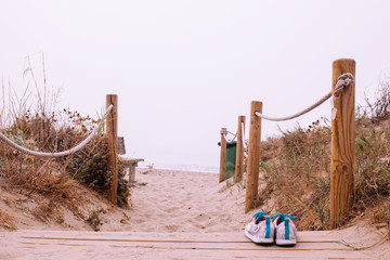Fog. Fog on the beach. Sneakers at a beach.