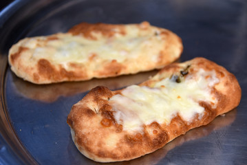 pizza bread with cheese and vegetables