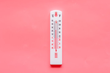 Weather thermometer on pink background top view copy space