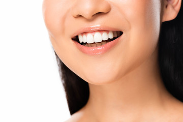 cropped view of beautiful asian woman with white teeth isolated on white