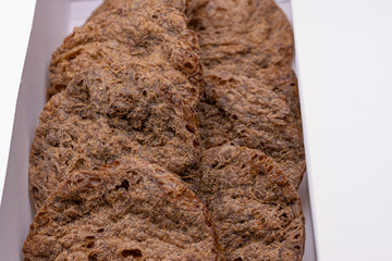 Dried vegan patties in a box isolated on white background