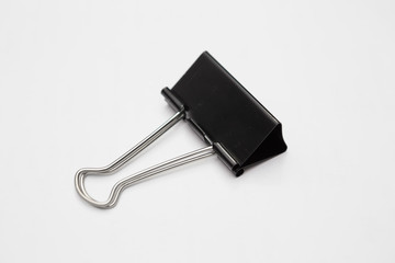 Close up of Black paper clip on  white background