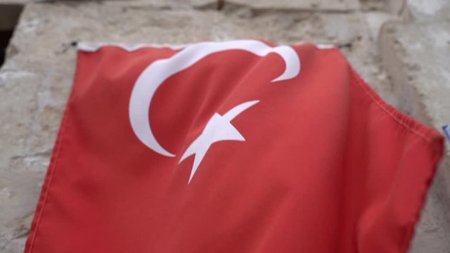 Slow motion of a draped Turkey flag blowing in the wind