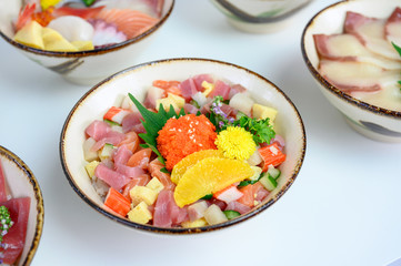Donburi variety diced raw fish with vegetable set on japanese rice