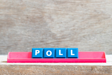 Tile letter on red rack in word poll on wood background