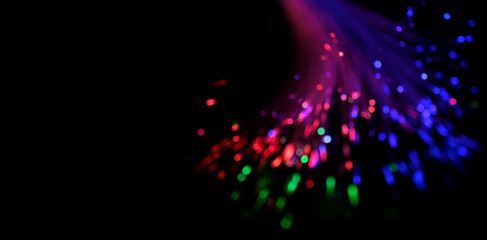 Bright golden bokeh lights abstract background. Abstract high-tech background of glowing fiber optic cable