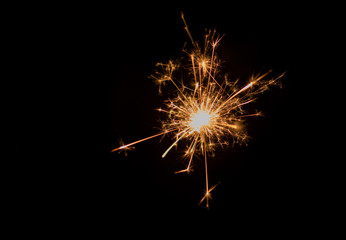 Sparkler and light bokeh background.Abstract and brightly colorful firework in the celebration and anniversary festival.Merry Christmas and New year party light over night sky.