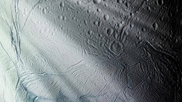 Enceladus, the sixth-largest Moon of Saturn, mostly covered by fresh, clean ice, making it one of the most reflective bodies of the Solar System. Elements of this video furnished by NASA. 