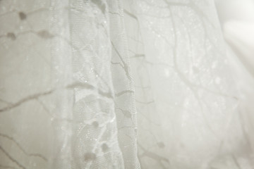 Details of the bride dress fabric and beautiful embroidery wedding concept used as a background for illustrations