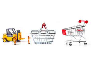 Miniature worker passenger  by truck and forklift to shopping cart and basket isolated on white background ,  Image for shopping online and delivery concept concept.