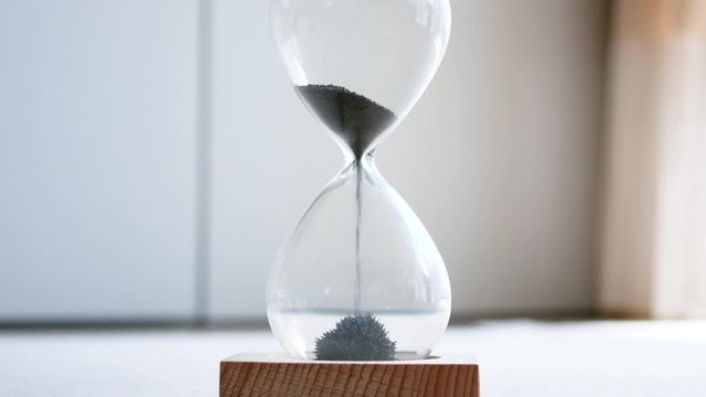 a sandglass made of iron powder and magnet.