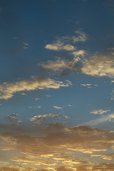 Naklejka na ściany i meble Vertical cloudscape with sunrise