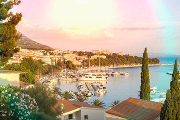 Sunset in Baska Voda town with Adriatic Sea and boats, Croatia