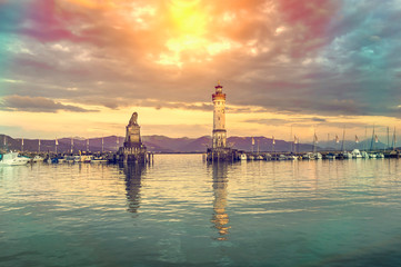 Beautiful evening seascape with lighthouse in harbor of Lindau - obrazy, fototapety, plakaty