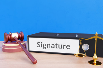 Signature – Folder with labeling, gavel and libra – law, judgement, lawyer