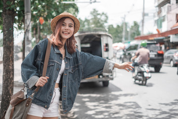 Fototapeta na wymiar Smiling woman traveler in chiangmai market landmark chiangmai thailand with backpack on holiday, relaxation concept, travel concept