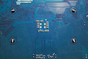 Back side of a blue computer mainboard