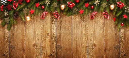 Fototapeta na wymiar Christmas wooden banner with decoration and fir tree. View with copy space.