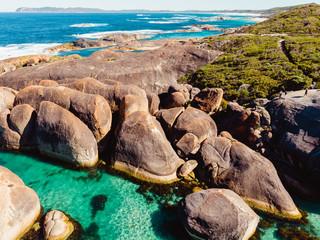 The beautiful and iconic elephant rocks in Denmark, Southern Australia. Shot aerially from a drone. Beautiful blue waters with very large and unique boulders along the coastline. 