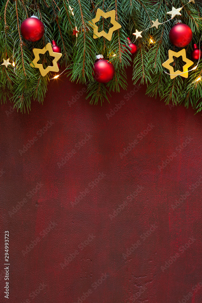 Wall mural сhristmas background with empty space for text or image.spruce branch with christmas decorations on 
