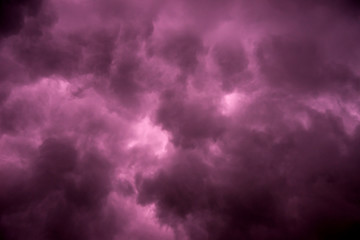 Dark sky and dramatic black cloud before rain.A tropical cyclone is a rapidly rotating storm system characterized by a low-pressure center, a closed low-level atmospheric circulation, strong winds.