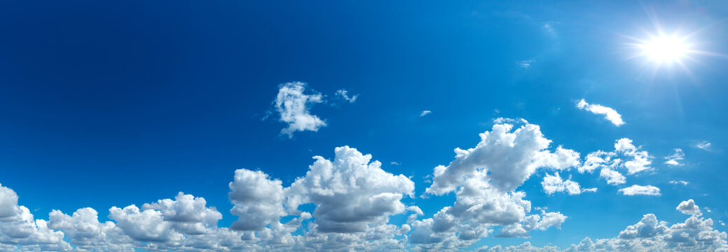 Panorama Sunlight with blue sky on dark background.Vivid sky on white cloud. © noon@photo