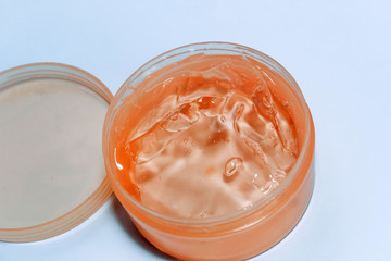 Cream gel cosmetic in a plastic container