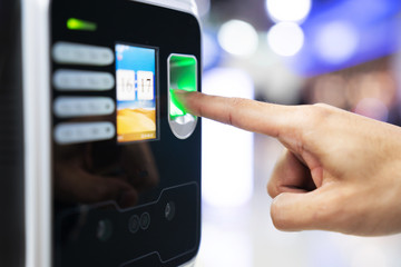Businessman hand scanning finger on machine,Technology concept, Business concept,