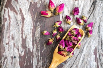 tea made from tea rose on wooden  background