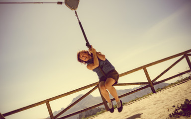Adult woman having fun on zipline