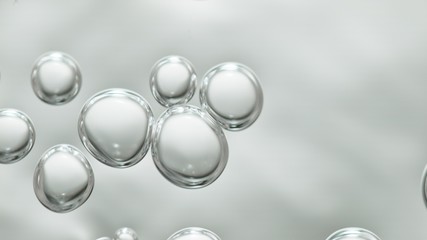 transparent gas bubbles on water surface. Worms-eye low angle with crystal bubbles in purified water on white background. cosmetic backdrop with copy space