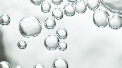 transparent gas bubbles on water surface. Worms-eye low angle with crystal bubbles in purified...
