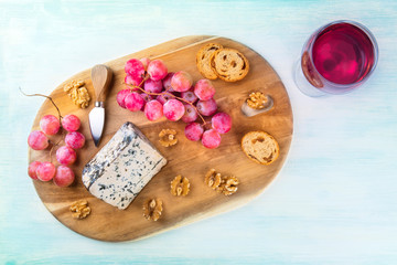 Gorgonzola cheese, shot from the top with a glass of wine and a place for text