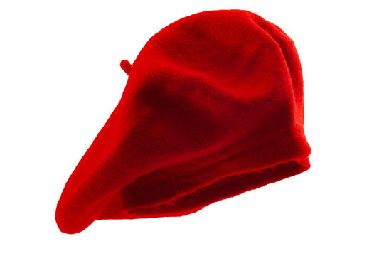 Posh attire and hip vintage fashion conceptual idea with red colour beret or french bonnet isolated on white background and clipping path cutout using ghost mannequin technique
