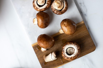 Fresh raw royal champignon on marble board