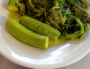 boiled zucchini and herbs salad with olive oil, healthy meditteranean vegan food