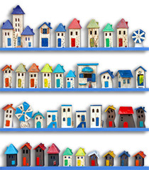 colorful ceramic houses made by hand, isoltated on white background