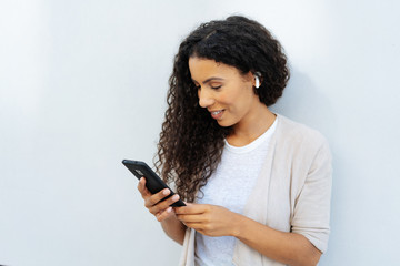 Young woman reading a text message on a mobile
