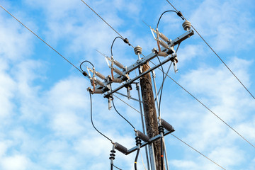 electric transmission tower wooden electricity pylon blue background