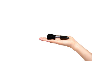 Hand with black eye makeup brush. Isolated