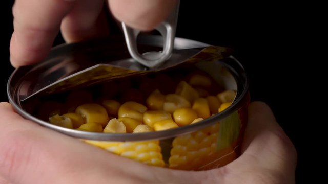Opening Can With Corn, On Black Background, close up static shot