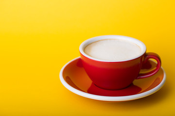 red cup on a  yellow background