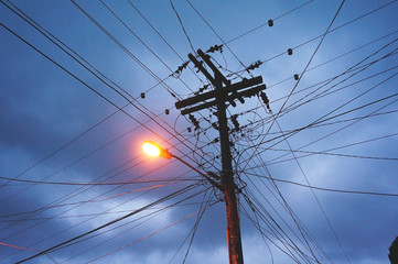 Electric pole with dark blue sky