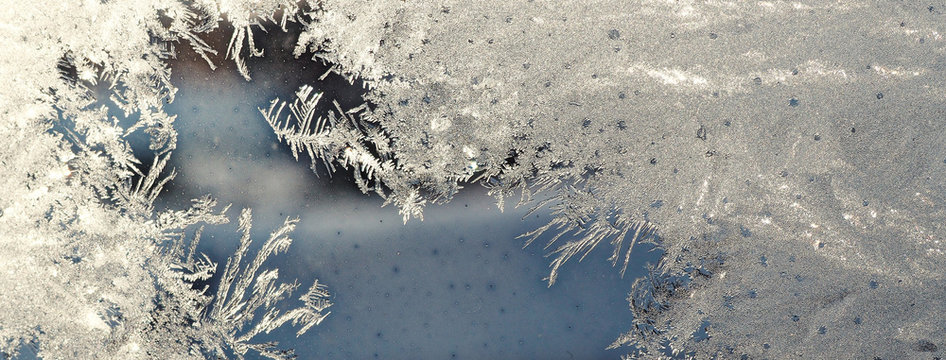 Silver winter background with frost pattern