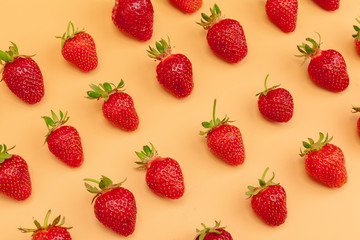 Strawberry flat lay on yellow background pattern
