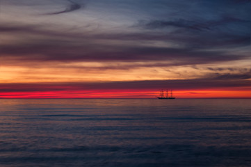 FRIGATE AND SUNSET - Evening dream of a beautiful sailing ship at sea