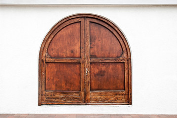 Old wooden massive door on building.