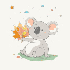 Lovely cute koala sits with a bouquet of yellow leaves. Autumn cartoon animal.